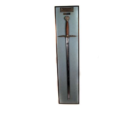 An RAF presentation sword by Wilkinson, awarded to Fli Lt C F Archer, 1934-1971, having decorative blade, inscribed, 'Dedicat
