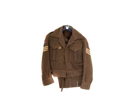 A WWII Royal Army Ordnance Corps Sergeant's jacket and trousers, having badge to breast and cloth badges to the arms, includi