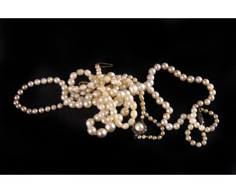 Three single string cultured pearl necklaces, one with a chip diamond clasp (3) 