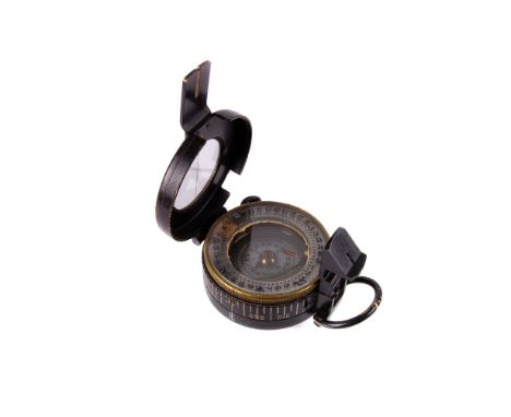 A black painted brass military compass, with fitted brown leather carry case (2) 