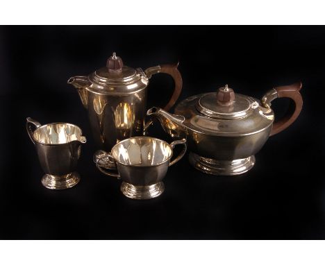 A silver three piece tea service by Mappin & Webb,  Sheffield 1969, the tea pot of compressed circular form with octagonal Ba