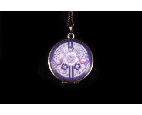 A modern enamel locket pendant by Michael Fray,  circular with printed bird and floral design, supported on a chain necklace 