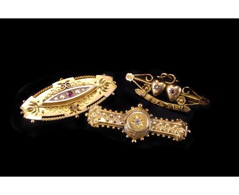 A group of five gold and yellow metal brooches,  including a Victorian 15ct and a 9ct example, a modern tri-colour 9ct gold, 