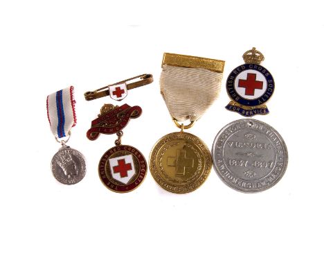 A WWI British Red Cross Medal,  together with three Red Cross enamel badges, a medallion and a miniature medal (6) 