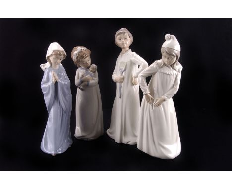 Four Nao 'Bedtime' figures,  each stamped with factory mark to base 