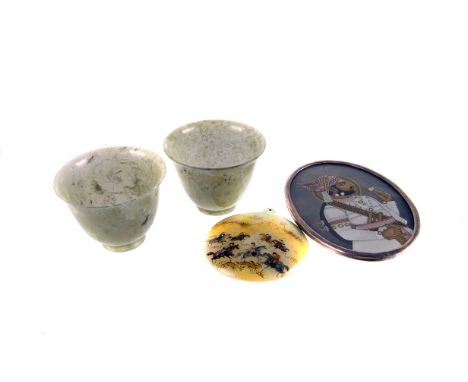 A pair of Chinese nephrite tea bowls,  together with a painted mother of pearl pendant, three lace maker's bodkins, an Indian