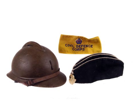 A repainted military helmet, together with a Civil Defence Corps armband and a beret with Russian badge (3) 