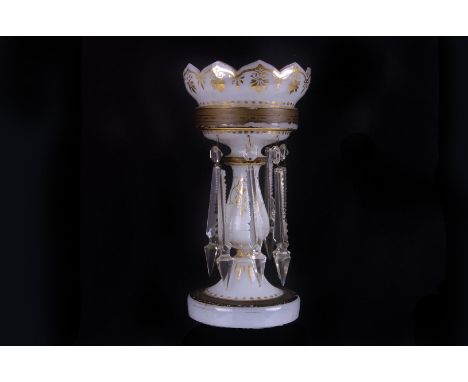 A lead crystal lustre candlestick, with hobnail decoration and facetted drops, 23cm high, together with a pair of  green glas