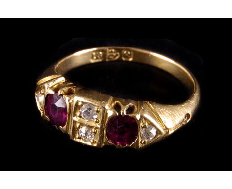 A late Victorian ruby and diamond six stone ring, the two principle oval cut rubies flanked with old brilliants, to an 18ct g