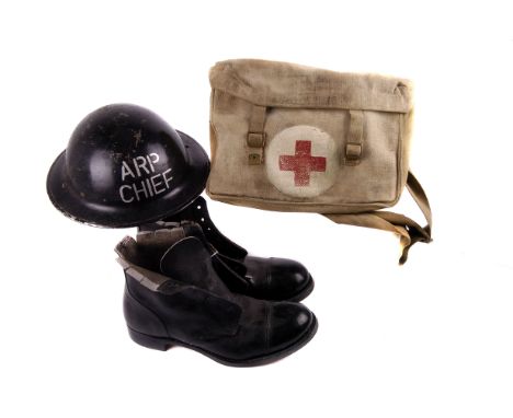 A selection of various military items, to include an ARP Chiefs helmet, an Air Training Corps beret, a pair of field adapted 