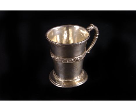 A George V Irish small silver tankard by West & Son,  Dublin 1932, with Celtic strapwork band and serpent headed handle, dent