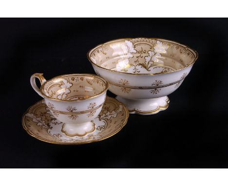 A Ridgeway porcelain part tea service,  circa 1830, with white porcelain body, gilt decoration overall above a beige border, 