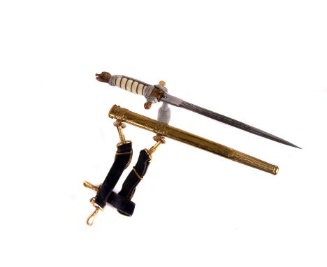 A WWII Kreigsmarine dagger, having decoratively engraved blade with anchors, eagle and swastika terminal, in gilt metal scabb