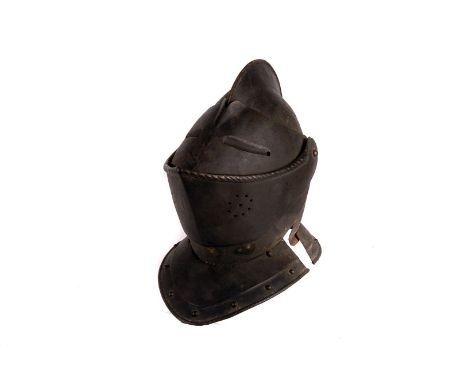 A late 16th century German style Cuirassier closed helmet, the steel helmet having separate pull down visor and mouth guard, 