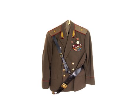 A Russian Major General's uniform, comprising jacket, with a Russian medal and a quantity of decorations, trousers, shirt, ti
