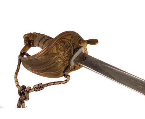 A George V 1827 pattern British Royal Naval Officer's Sword, having a lion's head pommel and white fish skin grip, leading to