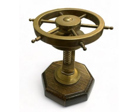 Brass Ships Wheel in the form of a nutcracker mounted on a wooden stand. Working order.