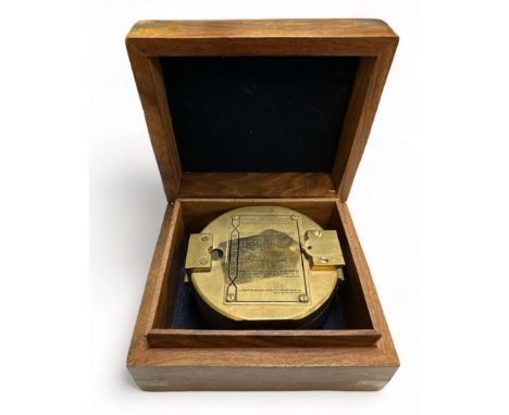 Brass Ships Compass housed in an attractive wooden box with anchor Cartouche. 