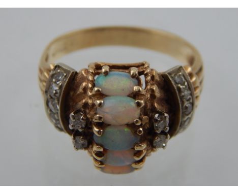 A 14 carat yellow gold, opal and diamond dress ring  