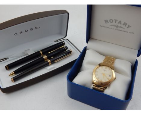 A cased gold plated Rotary Heritage gentleman's wristwatch together with three lacquer ball pens.
