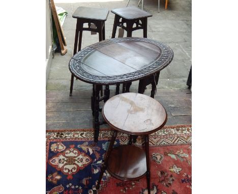 A Victorian circular mahogany occasional table, the moulded top above a tripod support joined by an undertier, D. 40cm, toget