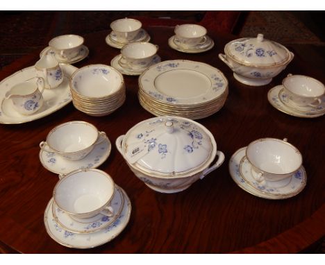 A Wedgwood 45 piece porcelain Ashbury pattern dinner service including soup bowls and saucers, two tureens and meat plate.