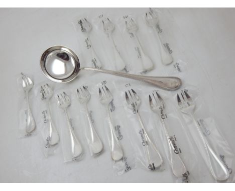 A boxed set of twelve Christofle cake forks and a ladle