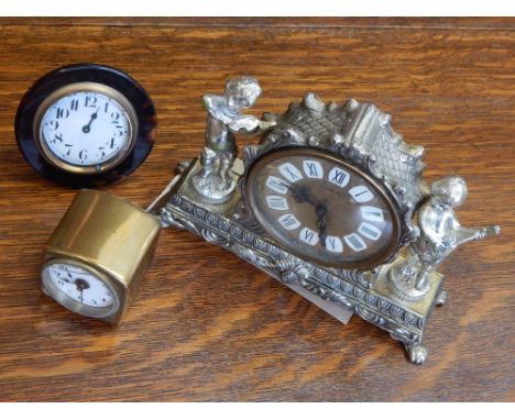 An early 20th century brass cased travel alarm clock, the white enamel dial set out with Arabic numerals, together with two f