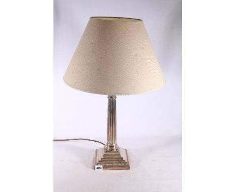 Silver plated Corinthian column table lamp raised on stepped square base by Goldsmiths and Silversmiths Company Limited of Lo