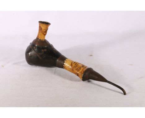 African carved bone and gourd pipe with face carvings to the bowl and stem and copper ware decoration, 35cm. 