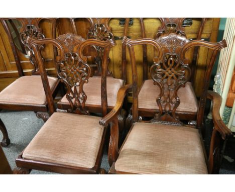 Set of eight Chippendale style mahogany shield back dining chairs with ribbon splats and slip in seats raised on cabriole sup