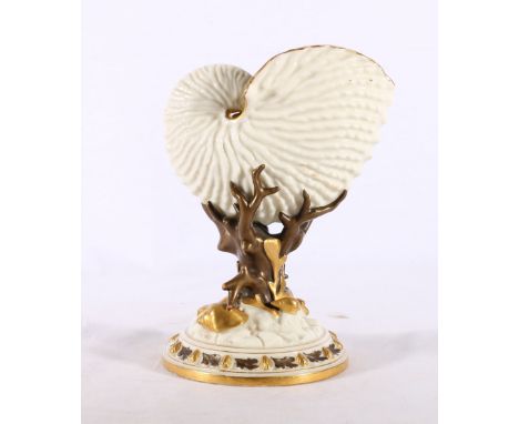 Royal Worcester porcelain vase in the form of a nautilus shell raised on naturalistic base, impressed and painted marks to ba