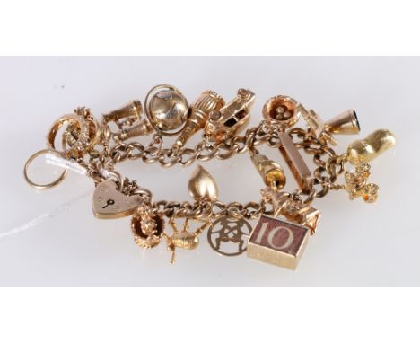 9ct gold curb link charm bracelet with padlock closure and twenty dependant charms including Bagpipes, Car, Globe, Ladder, 10