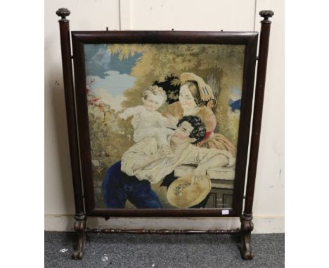Victorian rosewood firescreen with inset tapestry panel raised on column supports with scroll feet, 116cm x 86cm 
