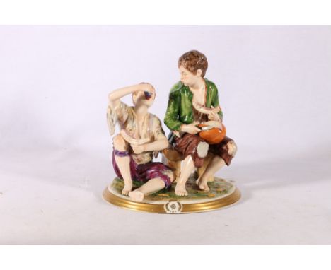 Capodimonte King's porcelain figure group of two peasants eating a melon, crown over K mark to base, 18cm tall 