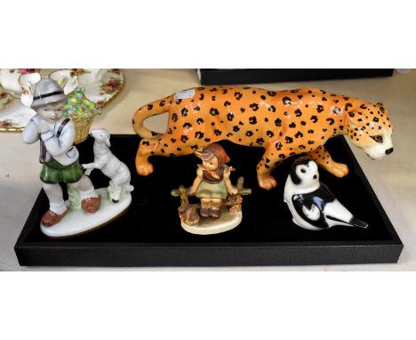 A group of porcelain figures including Beswich Leopard; Goebel young girl on a fence; Geroid figure of a young boy with lamb 