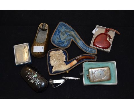 Smoking ephemera; a Meerschaum and amber cheroot holder cased; a Victorian inlaid papier mache snuff box with silver cased to