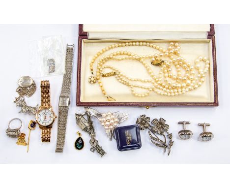 A lady's silver Longine wristwatch; a German Sterling silver and marcasite ring; a silver and cultured pearl brooch; a silver