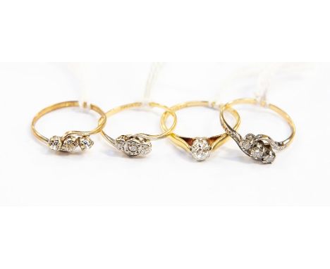 Two three-stone diamond rings, one stamped 18ct, gross weight approx 4gms; an 18ct gold solitaire diamond ring, size Q, 2.3gm