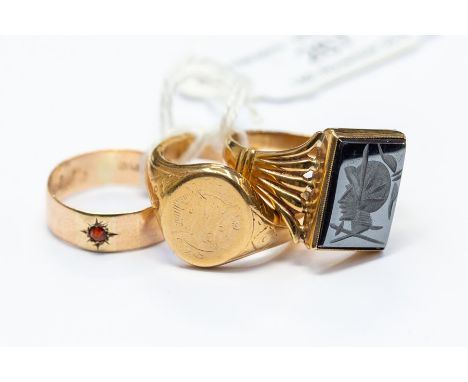 A 9ct signet ring, engraved monogram, size U1/2, approx 8.3gms; a 9ct ring, with haematite carved intaglio, size Y, approx 6.