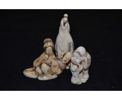 Three ivory Netsuke figures including an old man with mask, male figure on horseback and a male and female form