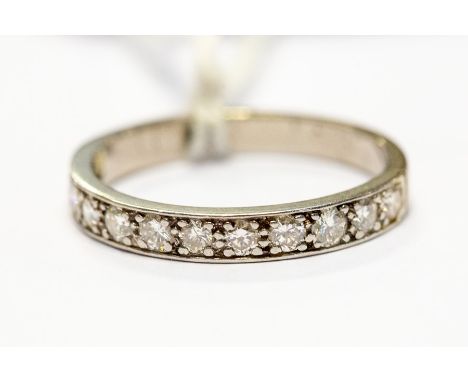 An 18ct white gold diamond half hoop eternity ring, total diamond weight approx 0.60ct, size Q, approx 3.3gms