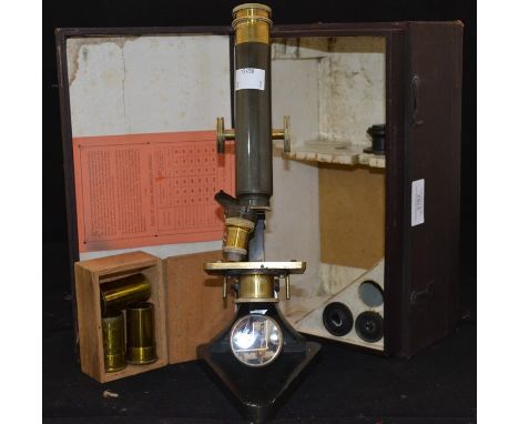 A compound achromatic microscope by R&amp;J Beck Ltd, London, serial number 21295, in box with spare lens etc