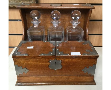 Oak cased three decanter tantalus, circa mid 20th Century