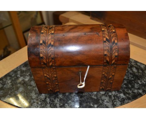 A small Tea Caddy with twin compartments. Inlaid decoration. Domed top. Complete with key. 20cm x 11.5cm plus 15cm in height.