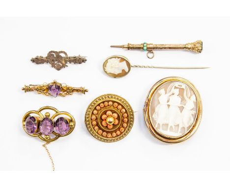 A Victorian yellow metal target brooch, set with coral; a 19th century cameo brooch; gilt metal and amethyst brooch; 9ct gold