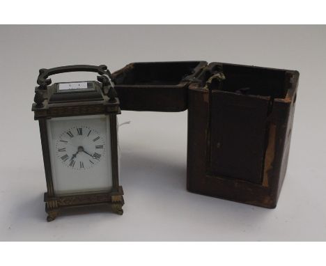 A late 19th Century brass carriage clock in travel case