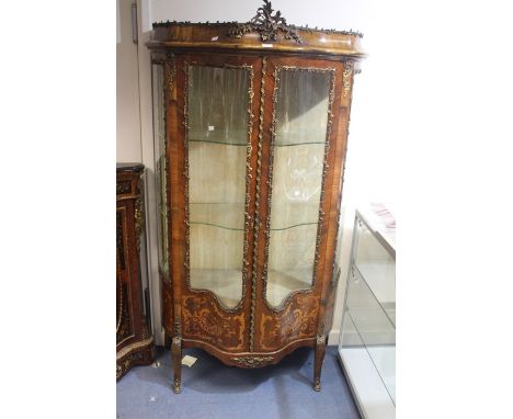 A Louis XV revival kingwood vitrine ormolu display cabinet, serpentine shape, ormolu decoration on the bombe form cornice, ab