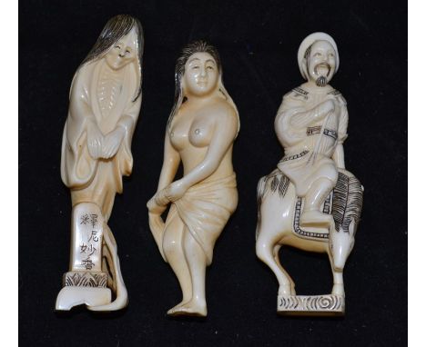 Three ivory figurines, Netsuke, comprising of a horseman, old lady and female figure