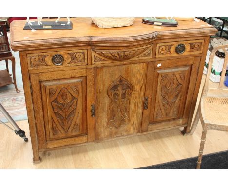 Art Nouveau oak sideboard with decorative panels, three drawers over two doors